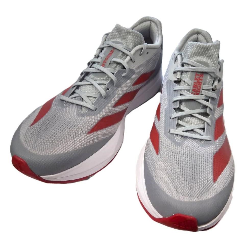 Adidas Adizero SL 2 – Vista lateral par gris/rojo fondo madera lifestyle