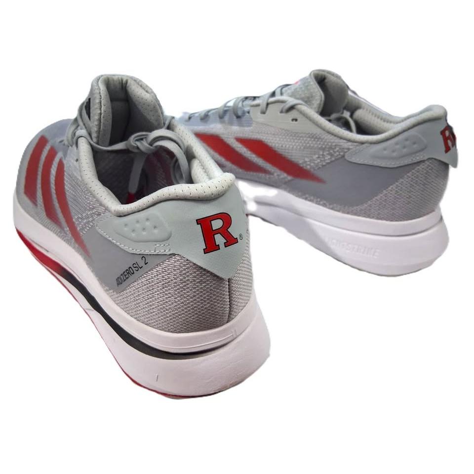 Adidas Adizero SL 2 – Vista 3/4 frontal par gris/rojo fondo arena lifestyle